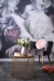 Beautiful bouquet of flowers on table in room. Stylish interior design