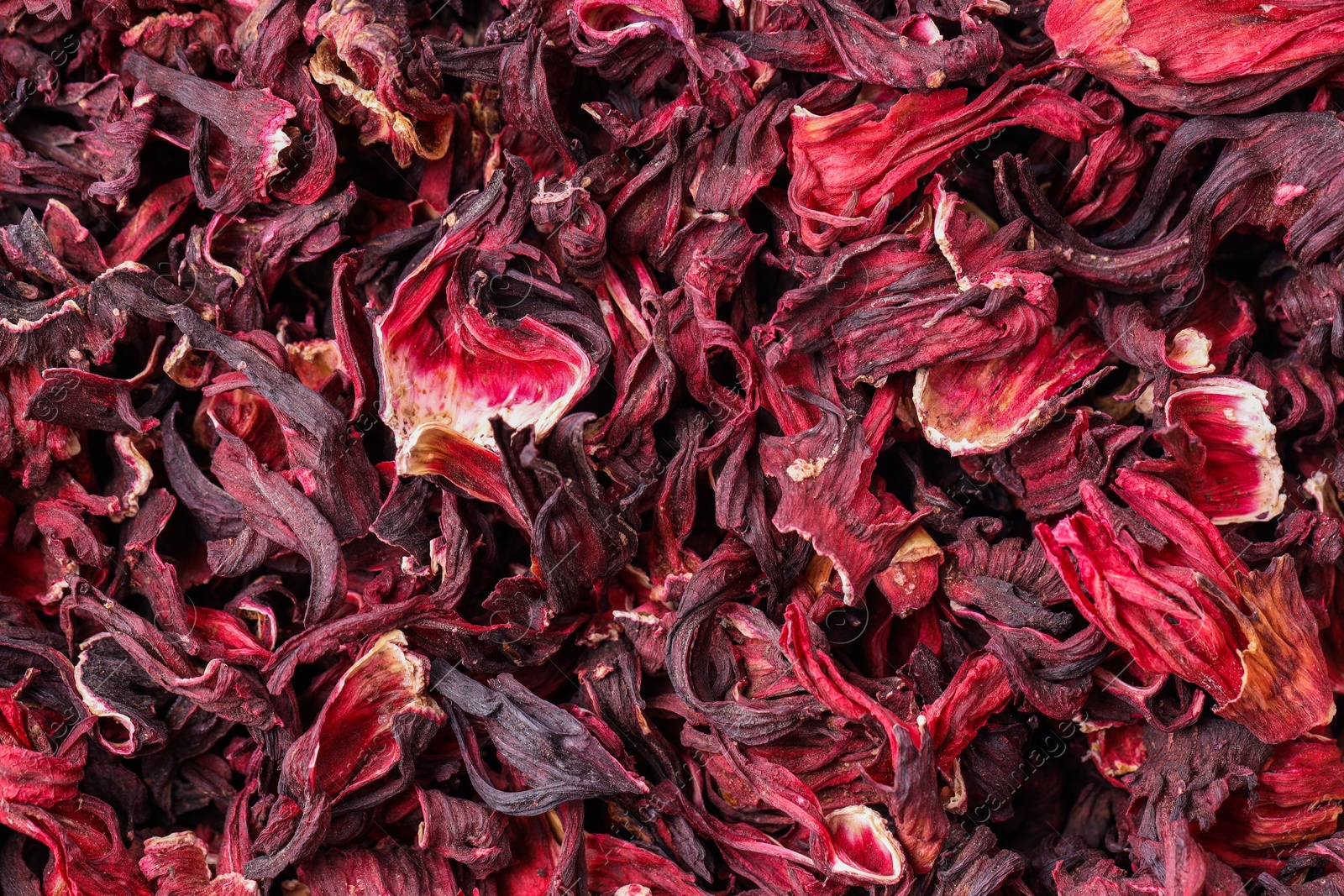 Photo of Dry hibiscus tea as background, top view