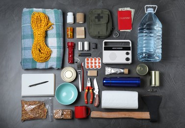Photo of Disaster supply kit for earthquake on dark grey table