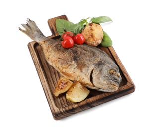 Photo of Delicious roasted dorado fish with vegetables, basil and lemon isolated on white