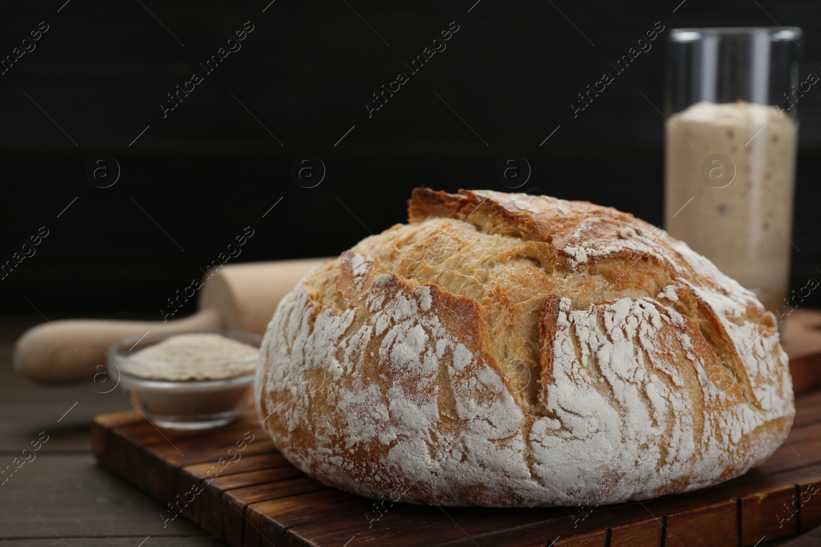 Photo of Freshly baked sourdough bread on wooden table food