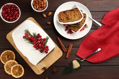 Flat lay composition with traditional classic Christmas cake on wooden table