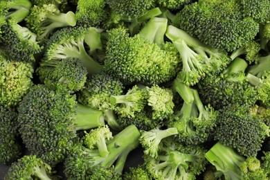 Photo of Fresh raw broccoli as background, top view