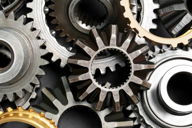 Photo of Many different stainless steel gears as background, top view