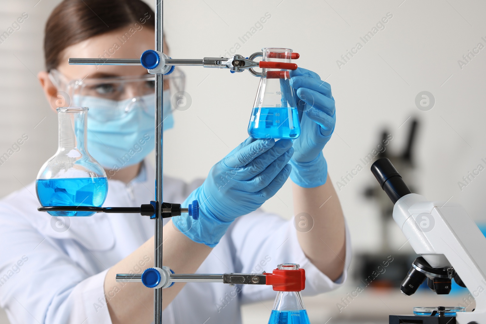 Photo of Young scientist working with samples in laboratory