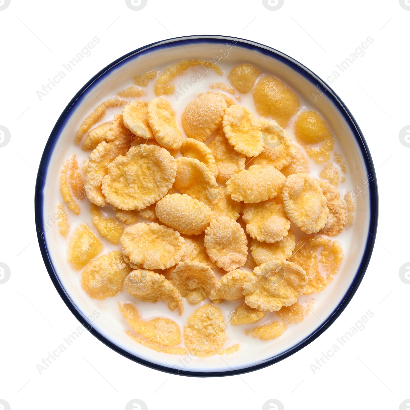 Photo of Tasty corn flakes with milk in bowl isolated on white, top view