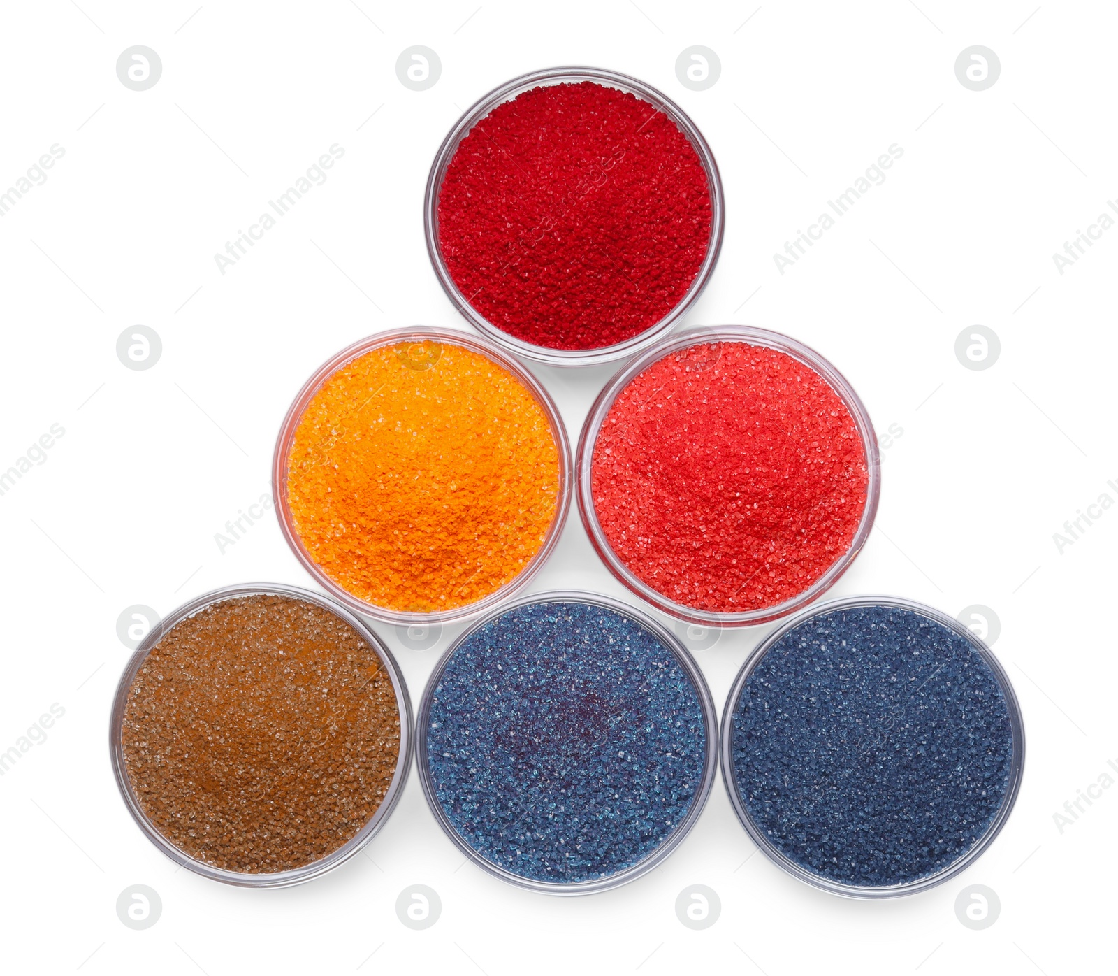 Photo of Glass bowls with different food coloring isolated on white, top view