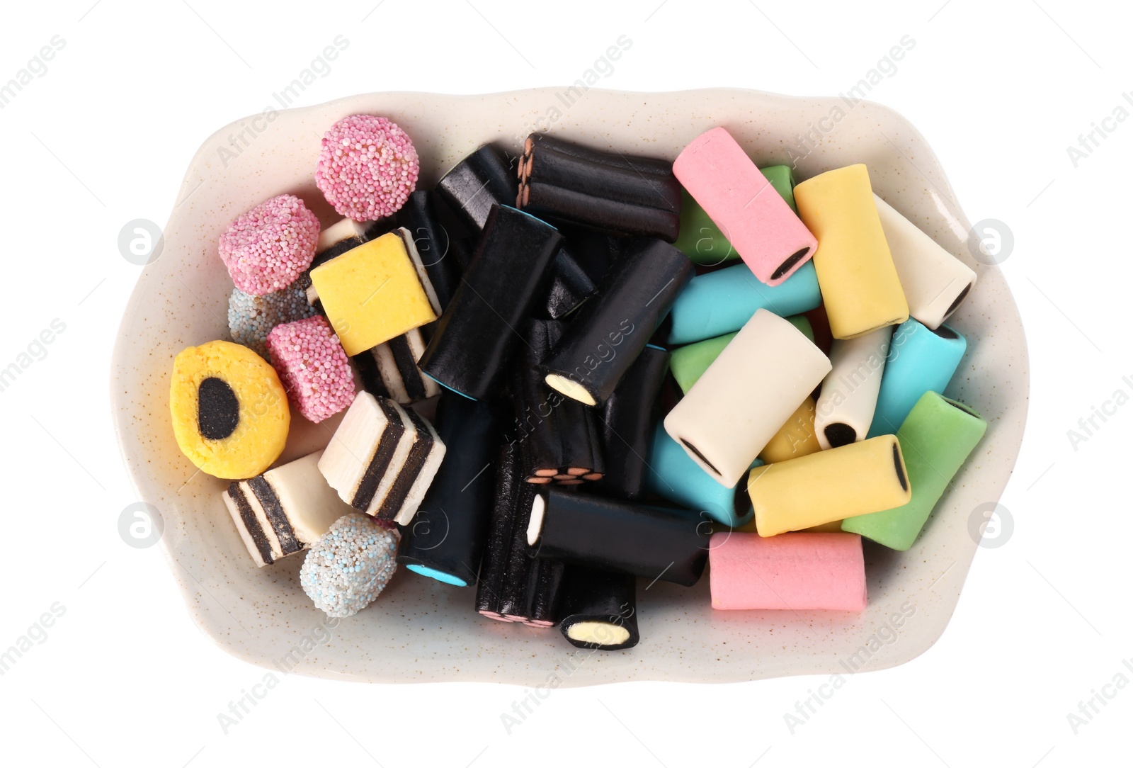 Photo of Tray with many tasty liquorice candies isolated on white, top view