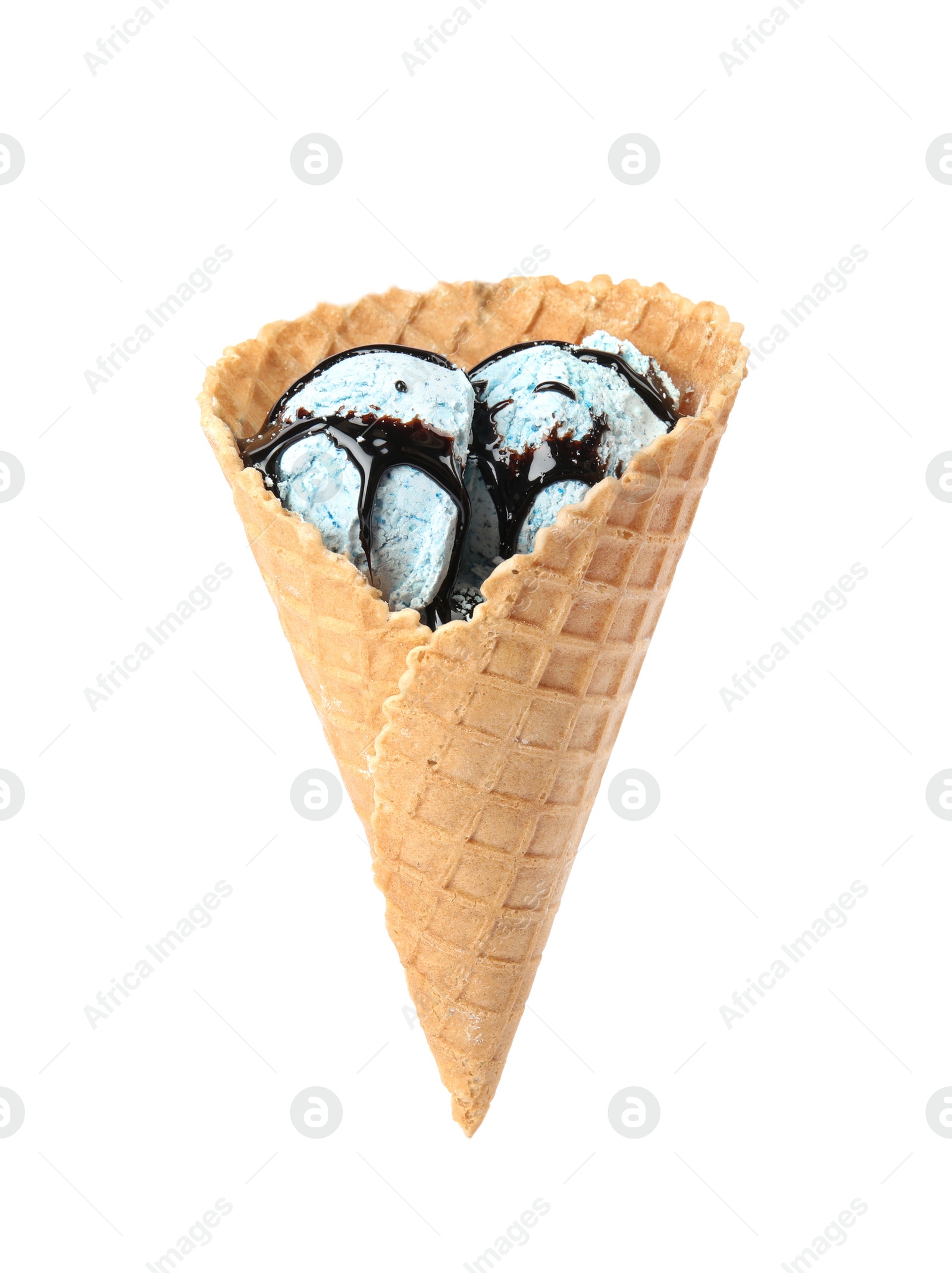 Photo of Delicious ice cream with topping in waffle cone on white background