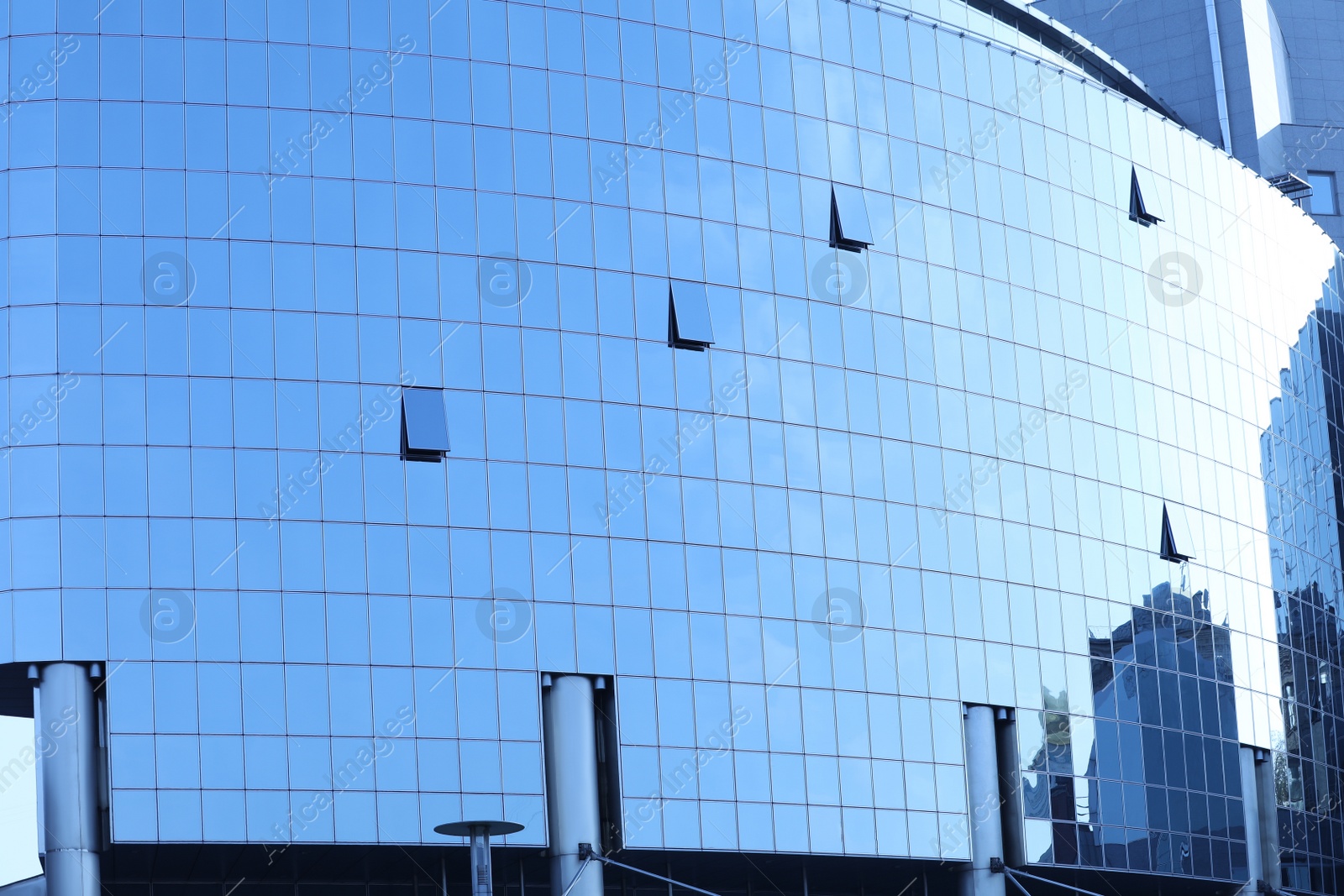 Photo of Office building with tinted windows. Modern architectural design