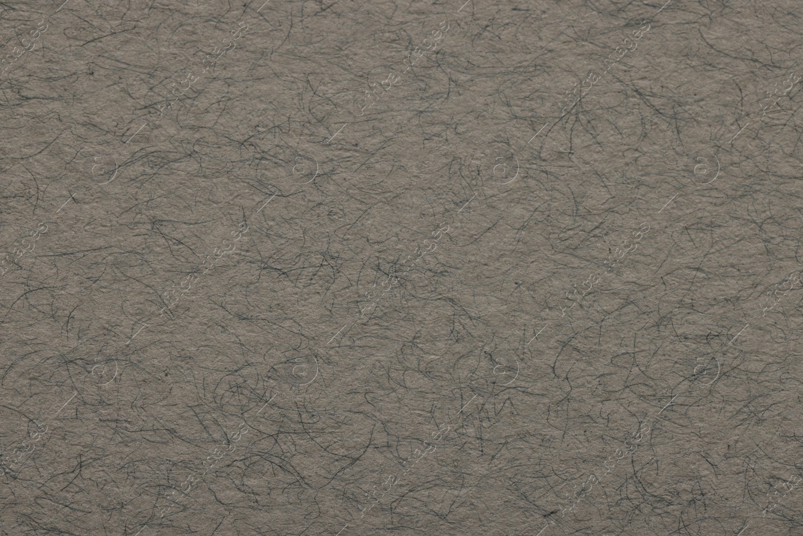 Photo of Texture of grey paper sheet as background, top view