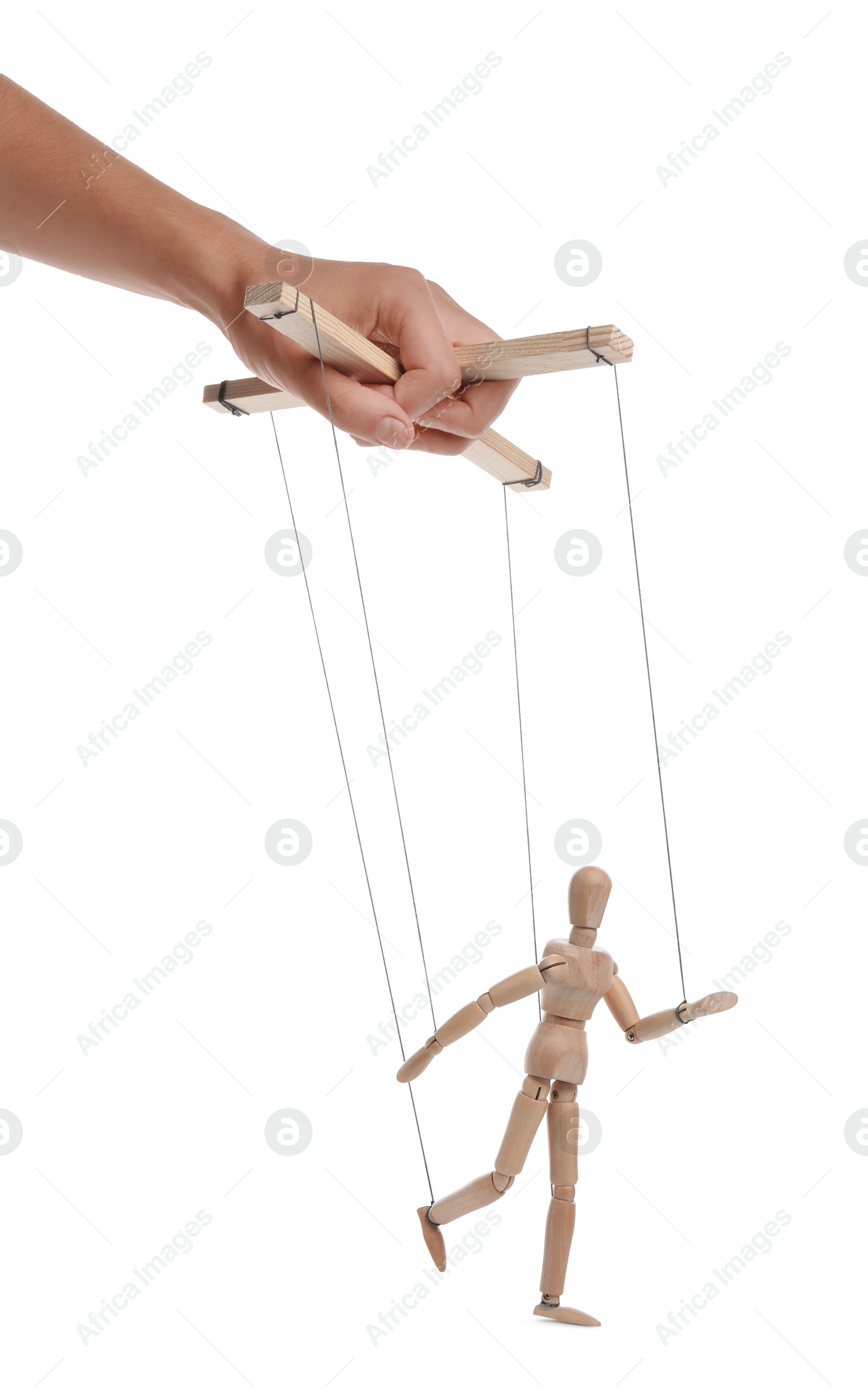 Photo of Man pulling strings of puppet on white background, closeup