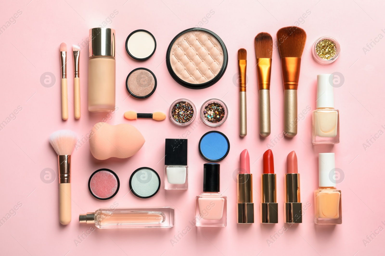 Photo of Flat lay composition with decorative cosmetics on color background