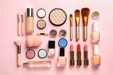 Flat lay composition with decorative cosmetics on color background