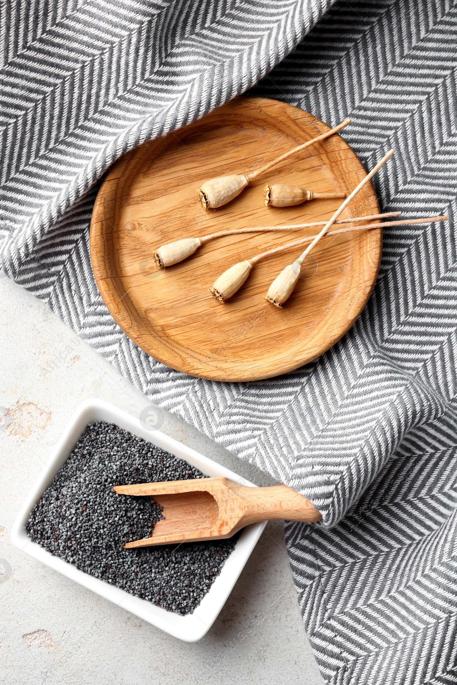 Photo of Flat lay composition with poppy seeds on grey background