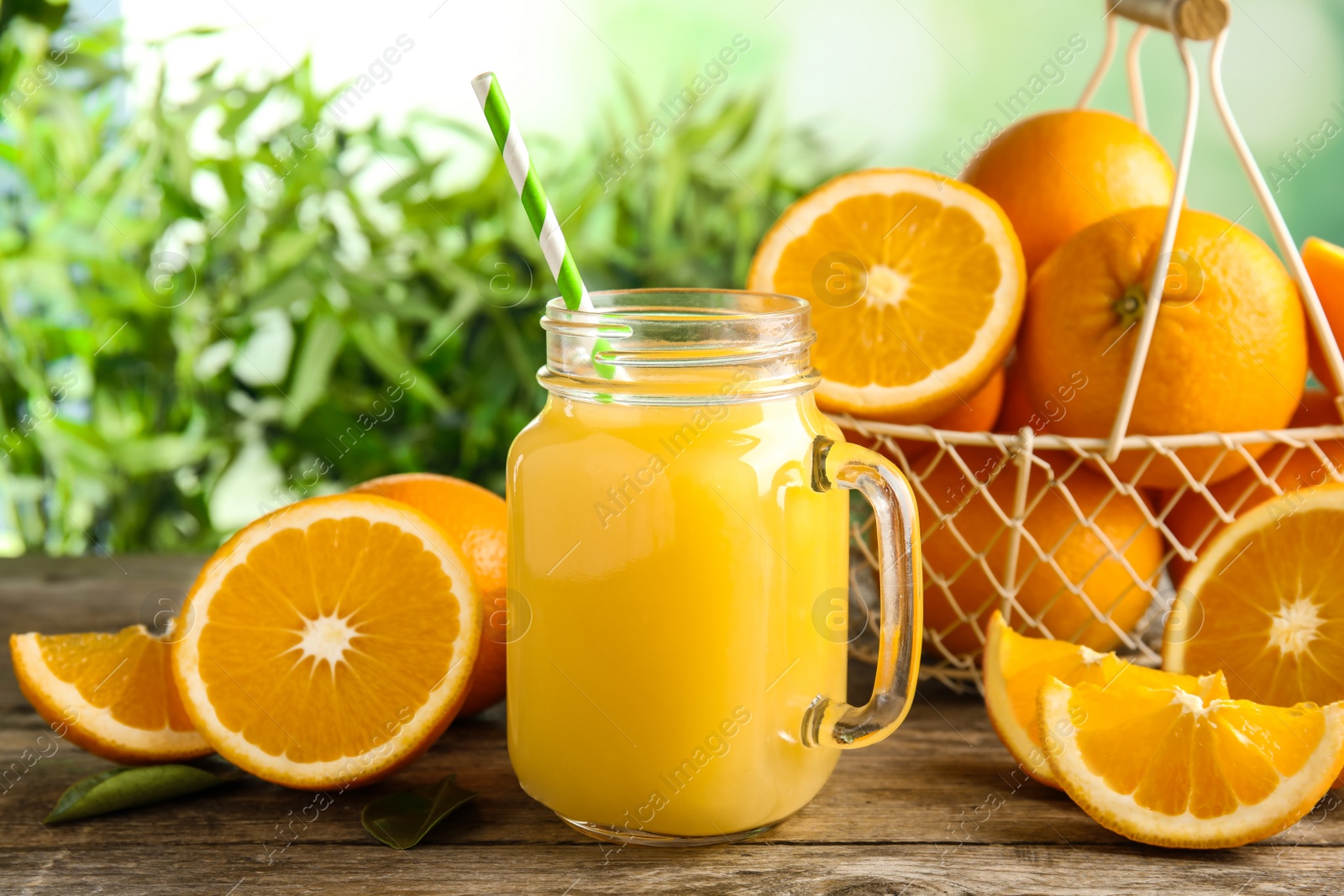 Photo of Composition with orange juice and fresh fruit on table