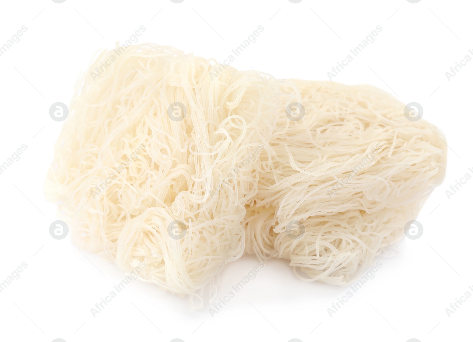 Photo of Bricks of dried rice noodles isolated on white. East Asian cuisine