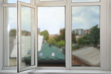 Open window with white plastic frame indoors