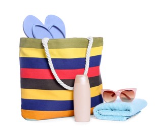 Photo of Stylish bag, sunscreen and other beach accessories isolated on white