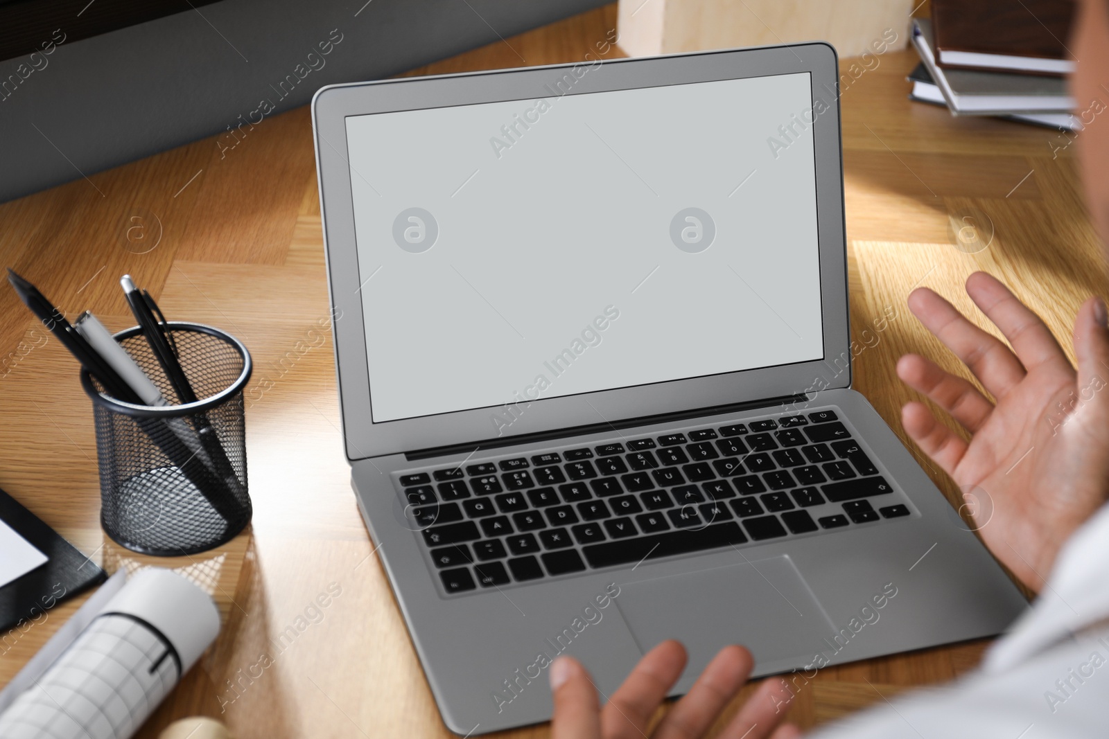 Photo of Coworkers working together online. Man using video chat on laptop, closeup