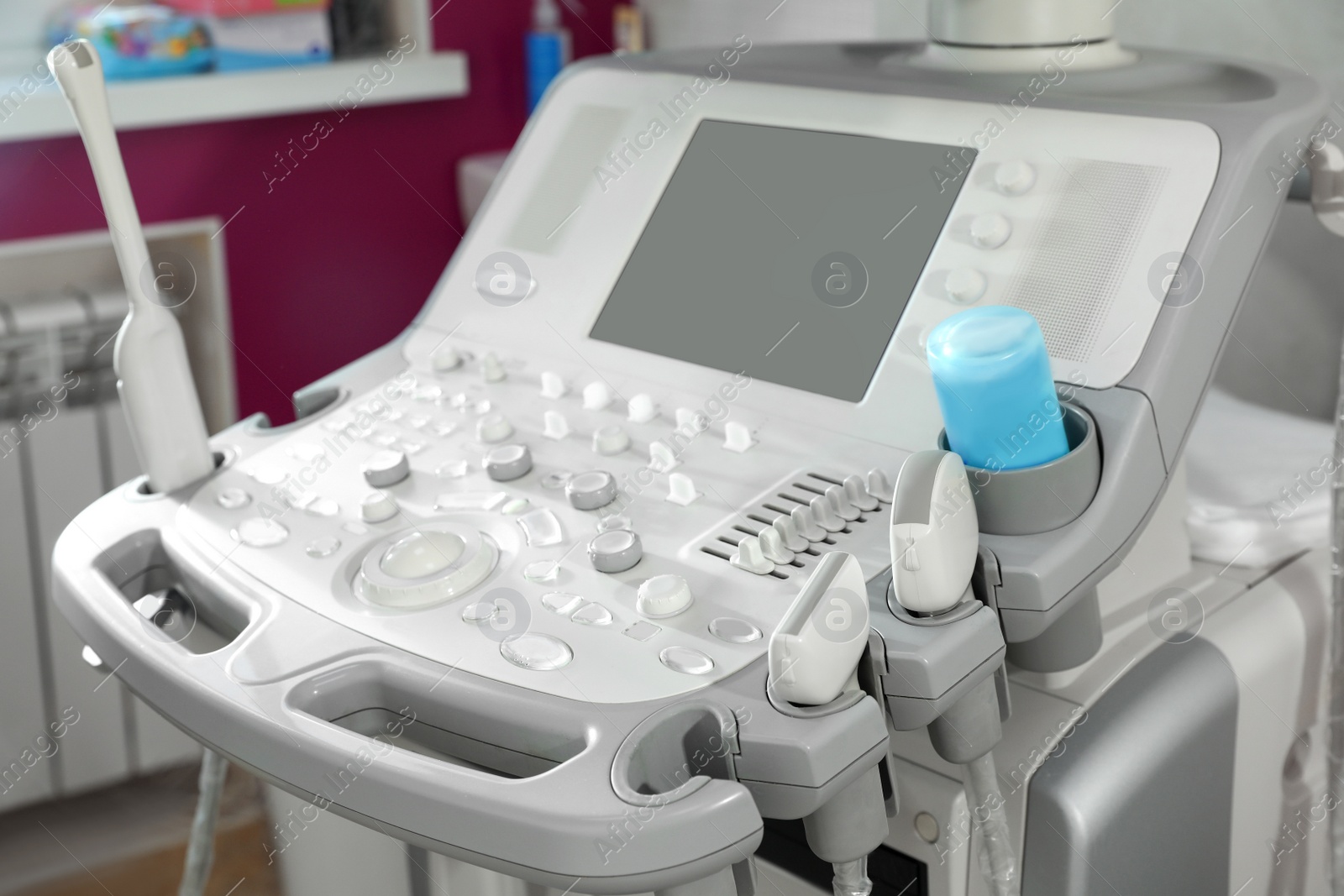 Photo of Modern ultrasound machine in clinic, space for text