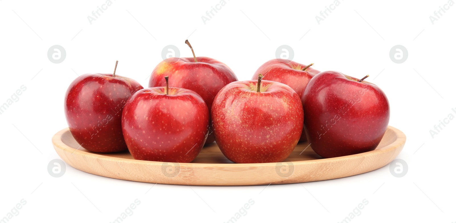 Photo of Wooden plate of ripe juicy red apples on white background