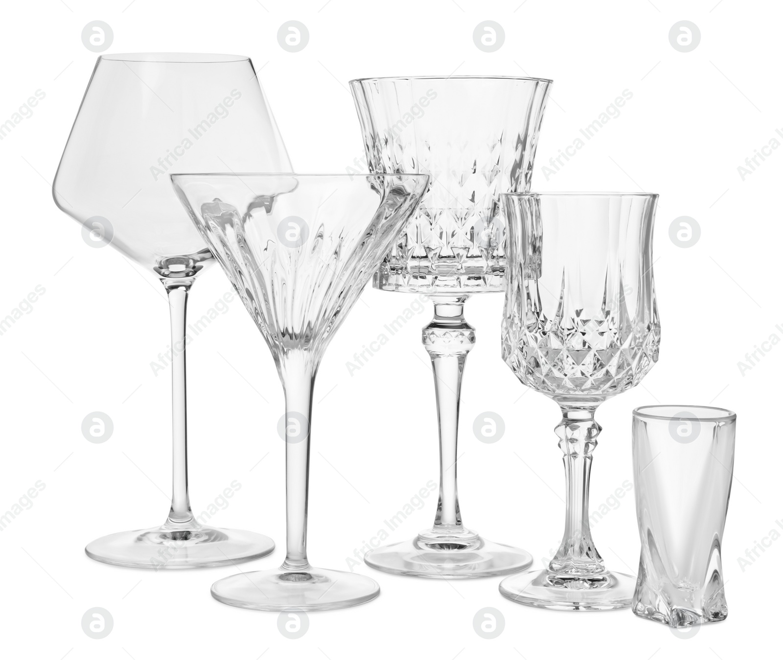 Photo of Different elegant empty glasses isolated on white