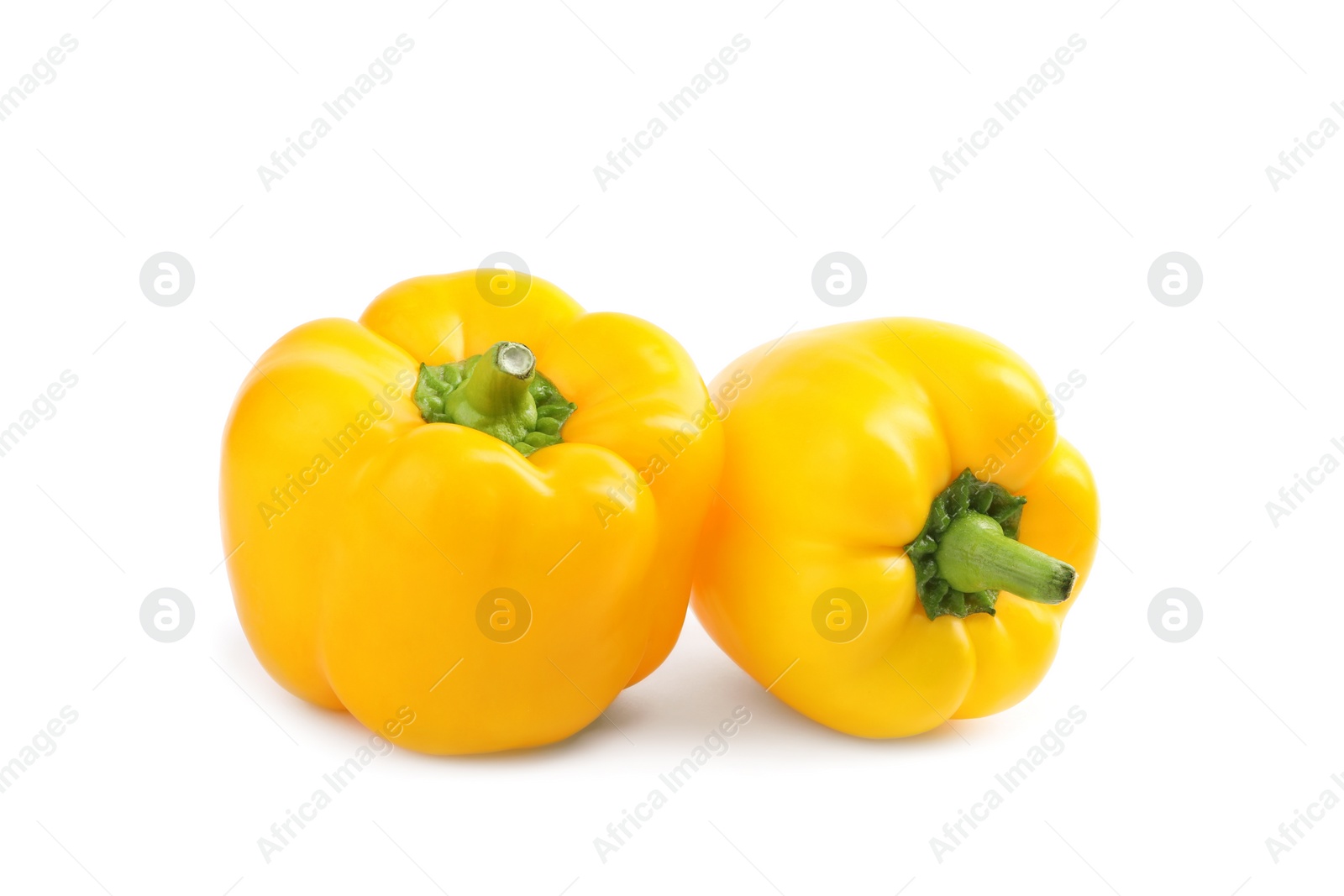 Photo of Fresh ripe yellow bell peppers isolated on white