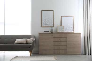 Photo of Modern room interior with stylish chest of drawers