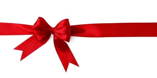 Red satin ribbon with bow isolated on white, top view