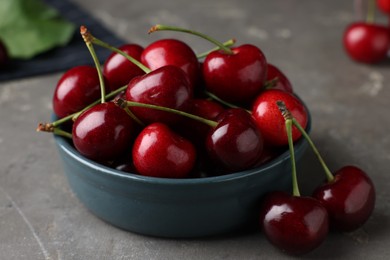 Fresh ripe cherries on grey table, closeup