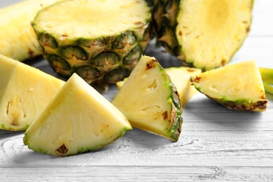 Photo of Fresh sliced pineapple on table, closeup