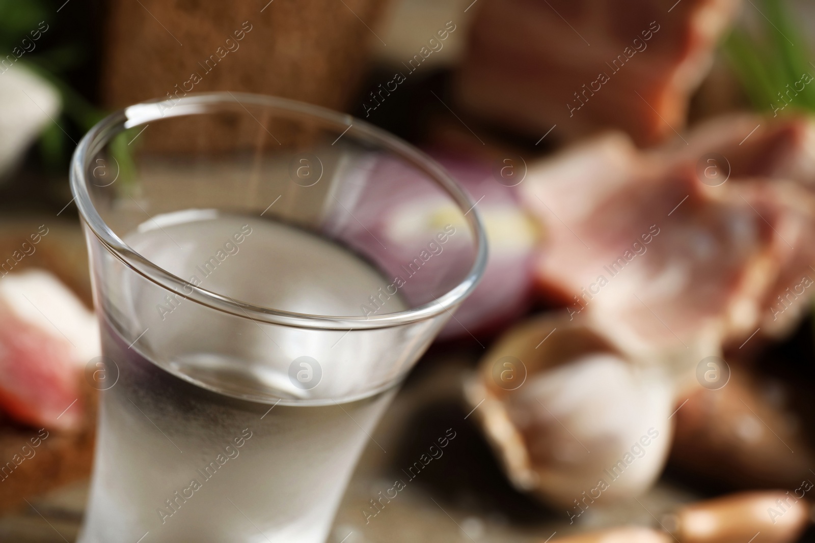 Photo of Cold Russian vodka on table, closeup. Space for text