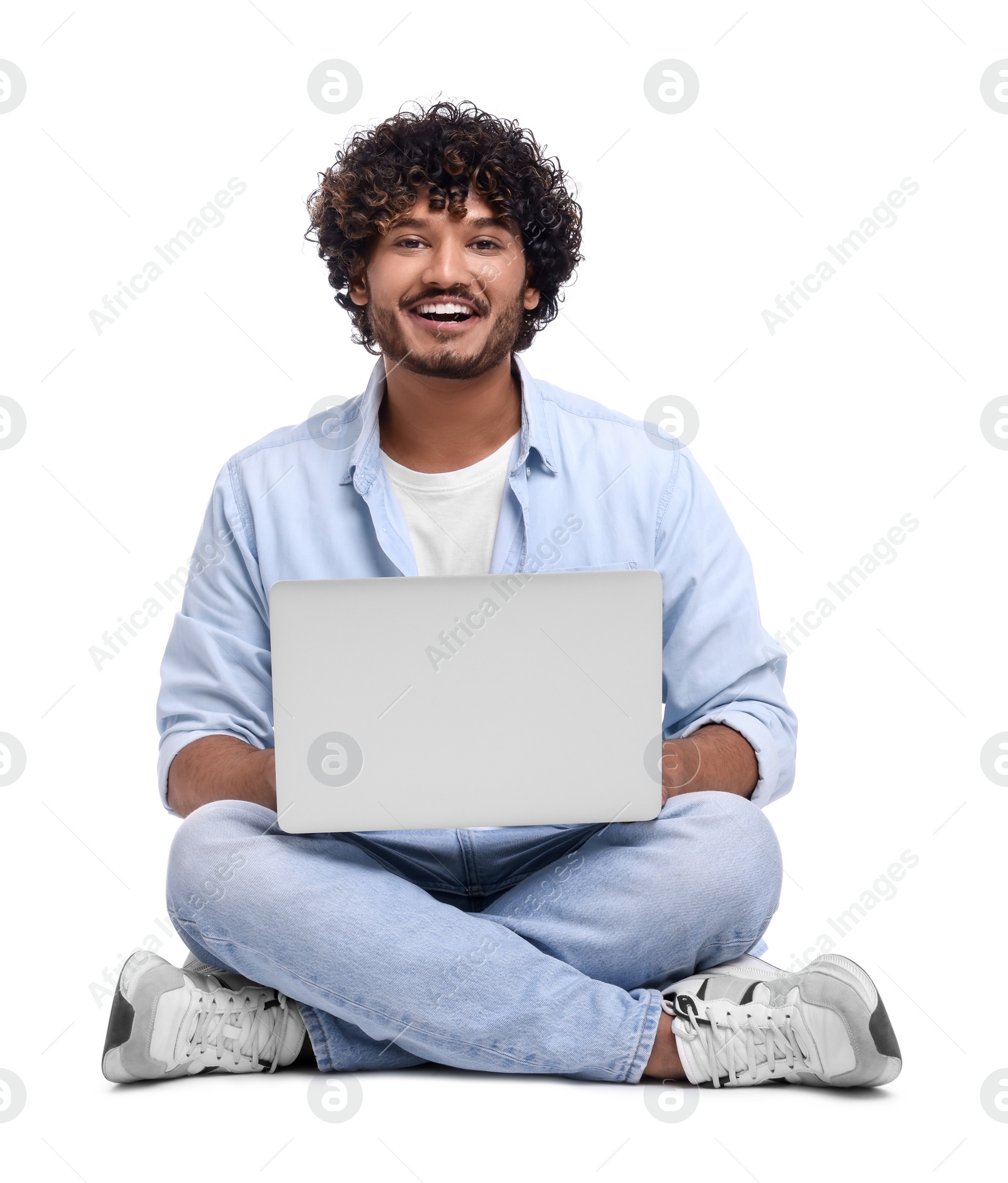 Photo of Smiling man with laptop on white background