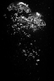 Photo of Air bubbles in water on black background