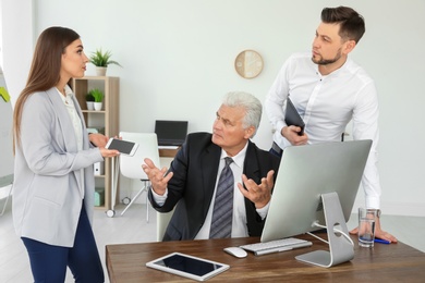 Photo of Office employees having argument at workplace