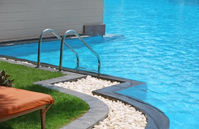 Modern swimming pool with stairs, outdoors