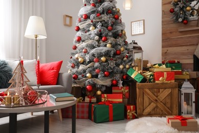 Image of Beautiful Christmas tree in living room. Festive interior