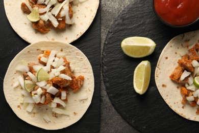 Photo of Delicious tacos with vegetables, meat and ketchup on grey textured table, flat lay