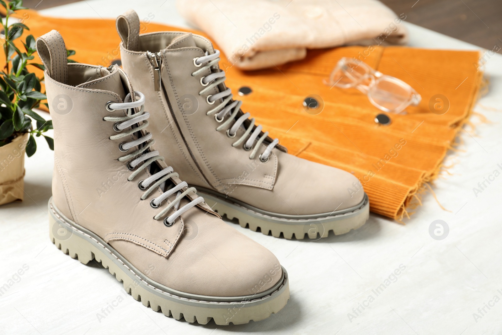 Photo of Pair of stylish boots on white background, closeup