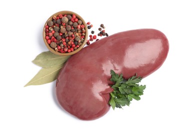 Photo of Fresh raw pork kidney with parsley, bay leaves and peppercorns on white background, top view