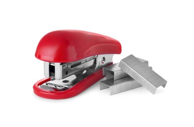 Photo of Bright red stapler with staples isolated on white