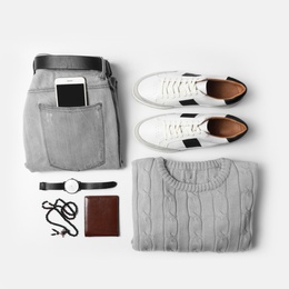 Stylish male autumn outfit and accessories on white background, flat lay. Trendy warm clothes