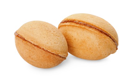 Delicious nut shaped cookies with boiled condensed milk on white background