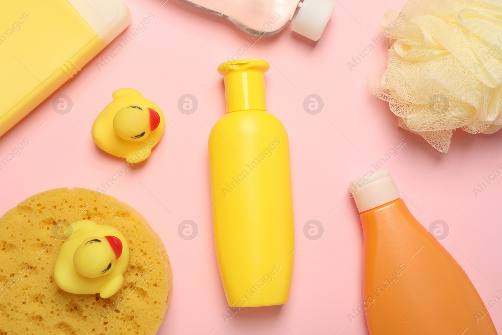 Photo of Flat lay composition with baby cosmetic products on pink background