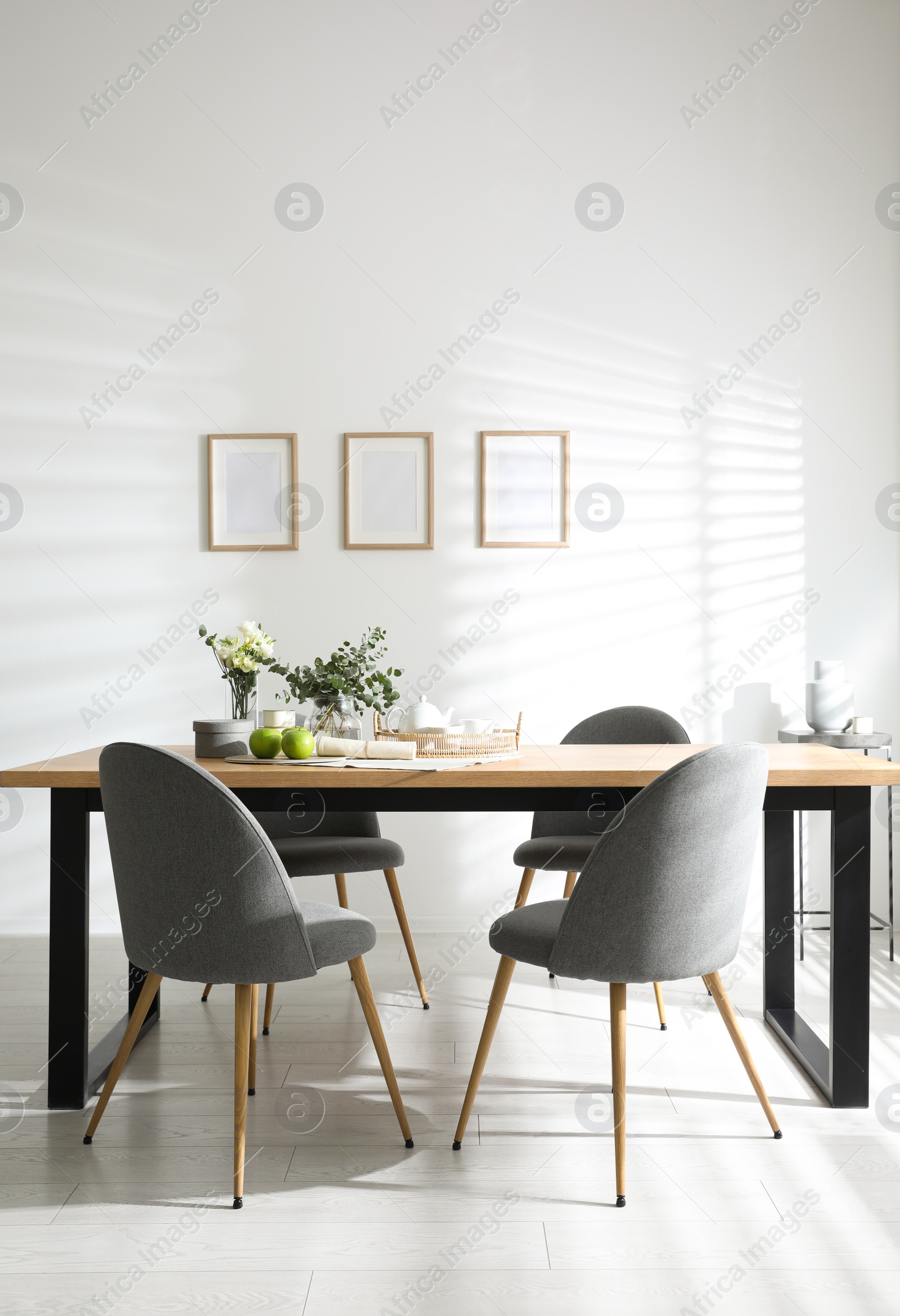 Photo of Stylish room interior with table and chairs. Idea for design