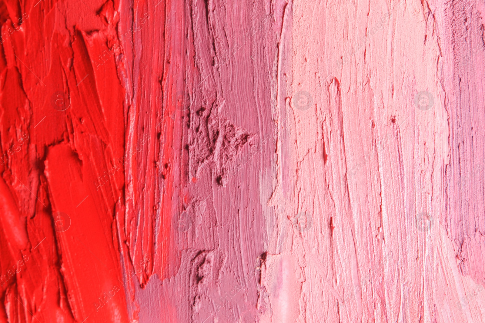 Photo of Strokes of lipstick as background, top view