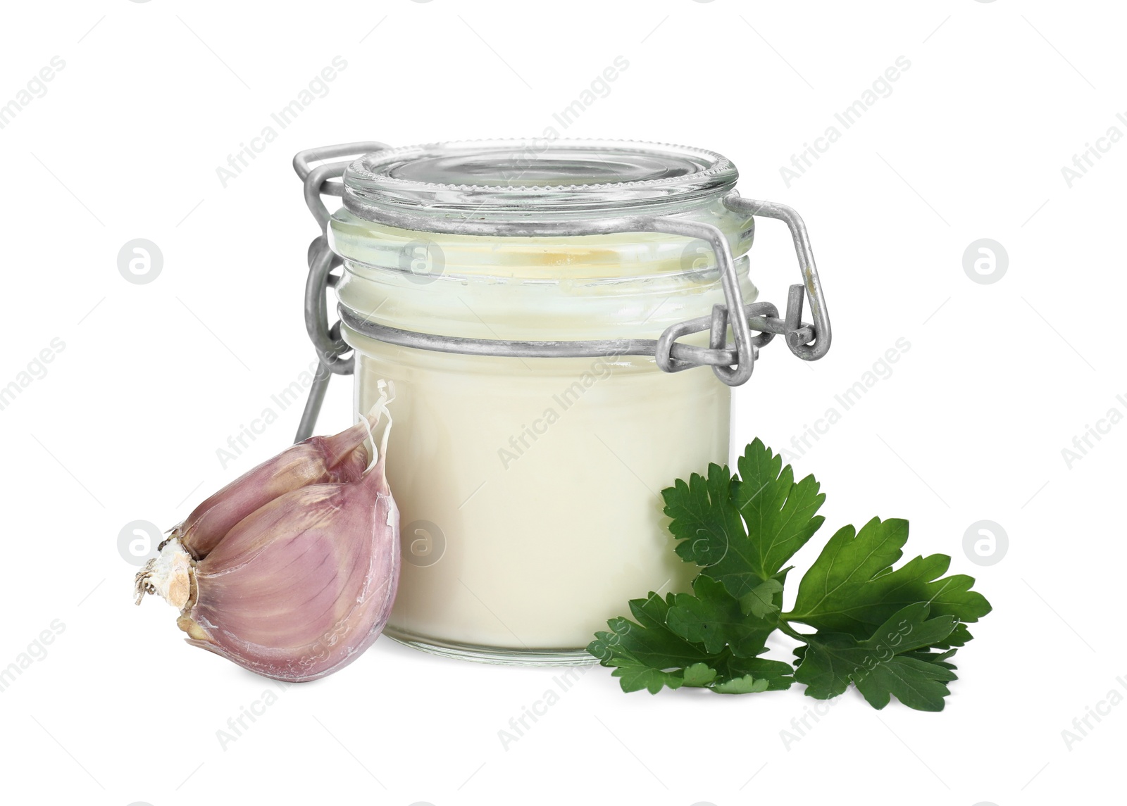 Photo of Fresh mayonnaise sauce in glass jar, garlic and parsley isolated on white