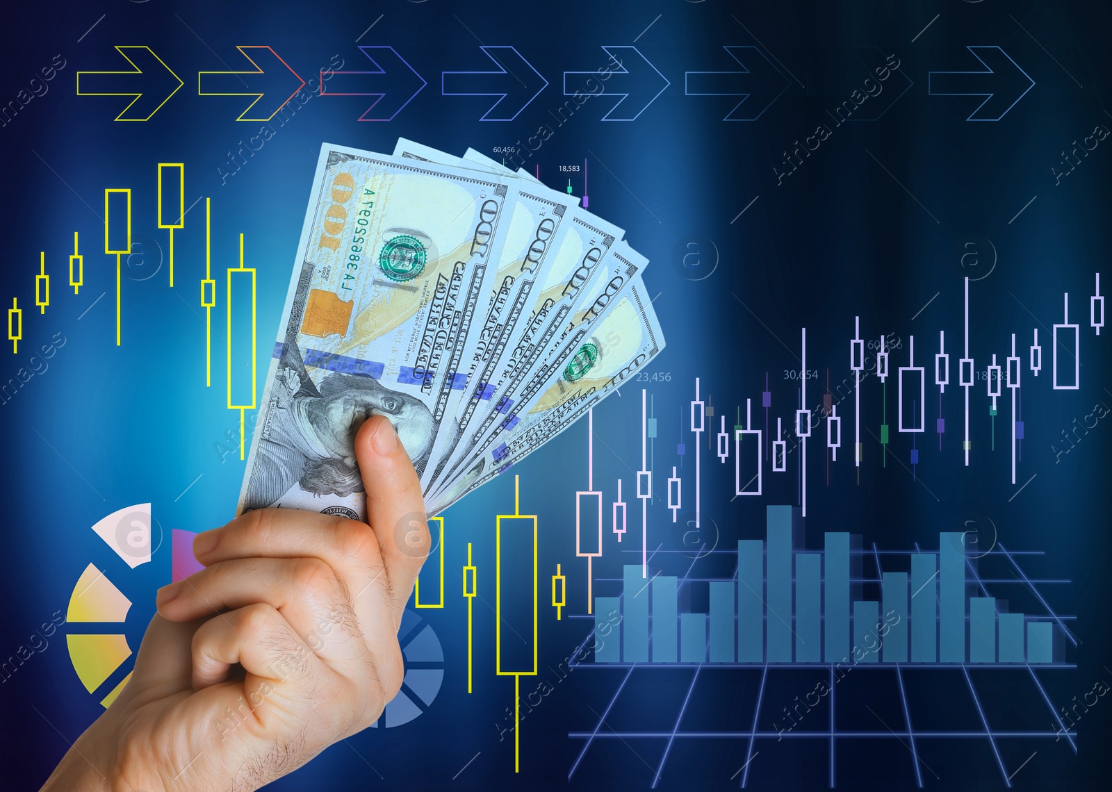 Image of Stock exchange. Man holding dollar banknotes against digital charts with statistic information, closeup