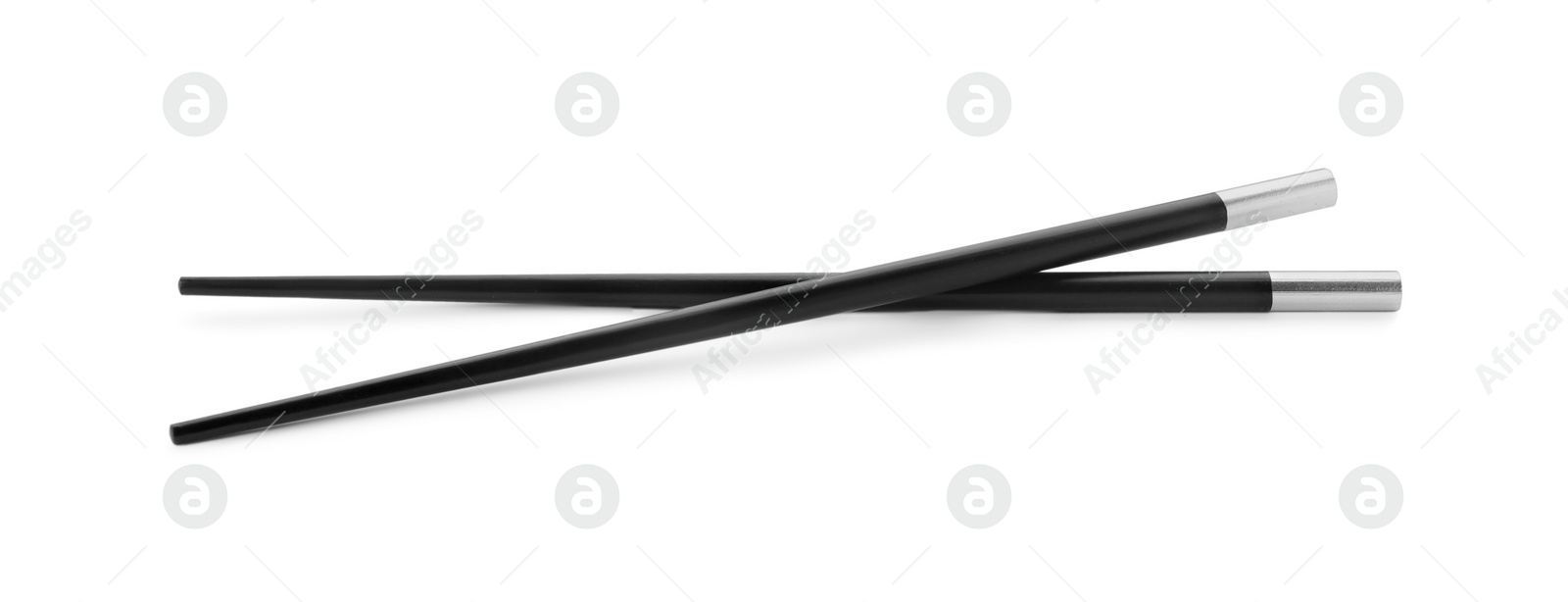 Photo of Pair of black chopsticks isolated on white